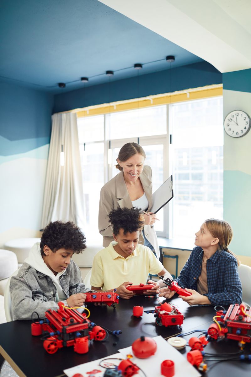 Kids building a robotics project in class